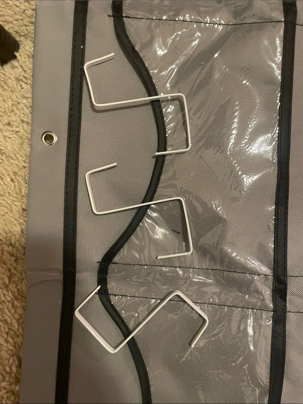 A hat holder that hangs on your door with 3 hooks great